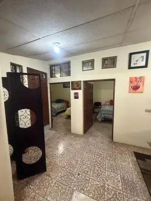 a room with a hallway with a room with a bed at La Joyona, Cozy House, Atiquizaya