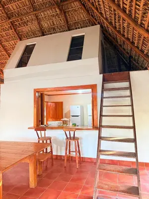 a room with a mirror and a wooden ladder at Rancho las Arantzas in Jujutla