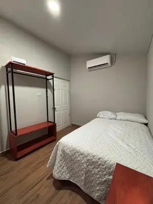 a bedroom with a large bed and a mirror at Quinta Los 3 Tesoros