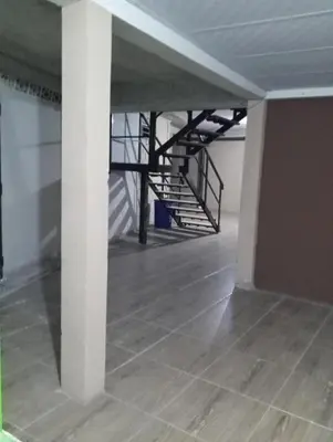 an empty room with a staircase in a building at Noche de luna in San Salvador