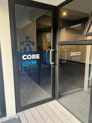 a glass door with a core gym sign on it at Premium comfy apartment Avitat Link, San Salvador in San Salvador