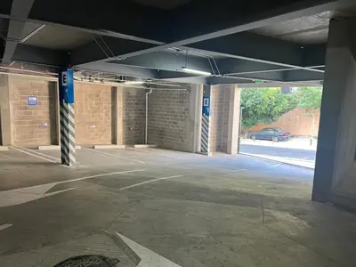 an empty parking lot in a parking garage at Premium comfy apartment Avitat Link, San Salvador in San Salvador