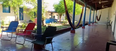 a group of chairs and tables on a patio at La Casona en el Corazon de San Miguel in San Miguel