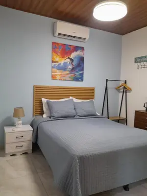 a bedroom with a bed and a ceiling at EL sunzal Bliss #8 in El Sunzal
