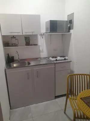a small kitchen with a sink and a microwave at EL sunzal Bliss #8 in El Sunzal