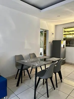 a dining room with a table and chairs at Hospedaje en san salvador in San Salvador