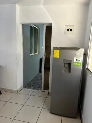 a elevator in a room with a hallway at Hospedaje en san salvador in San Salvador