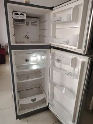 an empty refrigerator with its door open in a kitchen at Family house for 10 guest in Nejapa