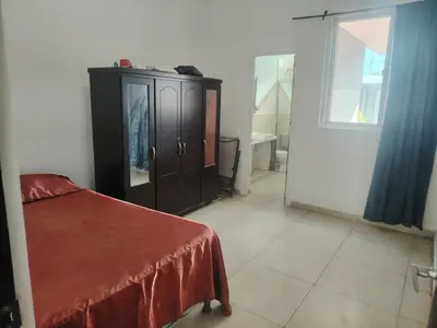 a bedroom with a bed and a cabinet and a window at Family house for 10 guest in Nejapa