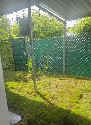 a backyard with a fence at Apartment with its own 100-inch cinema in Santa Ana