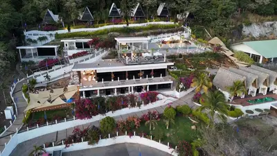 an aerial view of a building with flowers and plants at Hotel y Restaurante Buganvilias