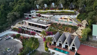 an aerial view of a house with a swimming pool at Hotel y Restaurante Buganvilias
