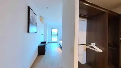 a hallway with a door leading to a bedroom at Enjoy San Salvador in Torre 91 in San Salvador