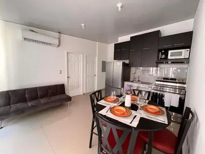 a kitchen with a table and chairs in a room at Nuevo San Miguel in San Miguel