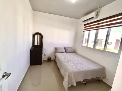 a small bedroom with a bed and a window at Nuevo San Miguel in San Miguel