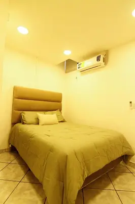 a bedroom with a bed in a room at Spacious Home - Cerca de Escalón in San Salvador