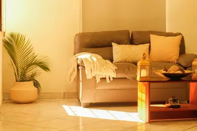 a living room with a couch and a table at Spacious Home - Cerca de Escalón in San Salvador