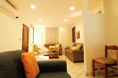 a living room with couches and a couch and chairs at Spacious Home - Cerca de Escalón in San Salvador