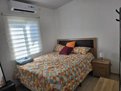 a bedroom with a bed and a window at San Francisco IV in San Miguel