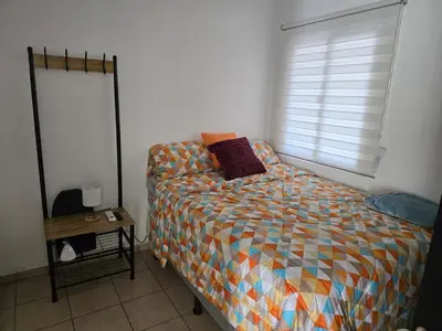 a bedroom with a bed and a window at San Francisco IV in San Miguel