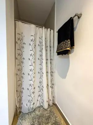 a shower curtain in a corner of a room at Anthonini's Apartment 6 guests San Salvador in San Salvador