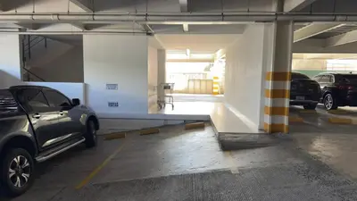 a parking garage with a car parked in it at Anthonini's Apartment 6 guests San Salvador in San Salvador
