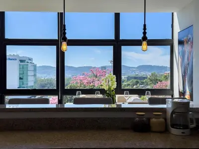 a bathroom with a large window with a view at Anthonini's Apartment 6 guests San Salvador in San Salvador