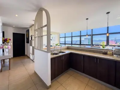 a kitchen with a sink and a large window at Anthonini's Apartment 6 guests San Salvador in San Salvador