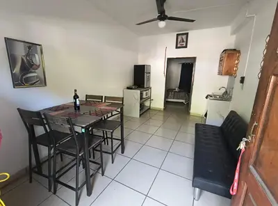 a dining room with a table and chairs in a room at Apartment in Playa Las Flores La Libertad in La Libertad