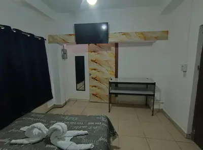 a room with a bed with two towels on it at Apartment in Playa Las Flores La Libertad in La Libertad