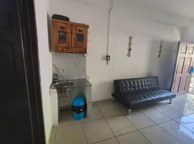 a living room with a couch and a sink at Apartment in Playa Las Flores La Libertad in La Libertad