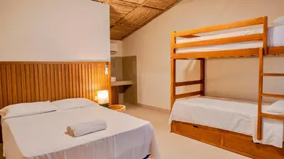 a bedroom with two bunk beds and a ladder at Villa Con Piscina, Playa, Jacuzzi, Kayaks in Conchagua