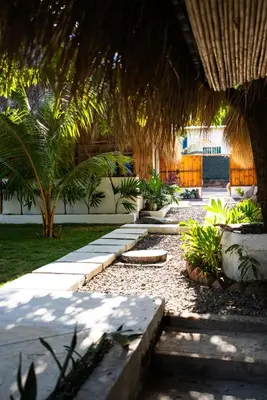 a garden with a pathway with trees and plants at Villa Con Piscina, Playa, Jacuzzi, Kayaks in Conchagua