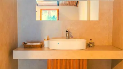 a bathroom counter with a sink and a mirror at Villa Con Piscina, Playa, Jacuzzi, Kayaks in Conchagua