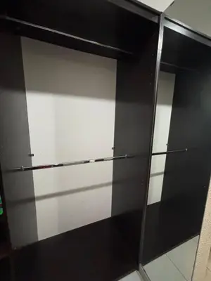 a black and white closet with two glass shelves at Apartment in Colonia Escalón with pool and gym in San Salvador