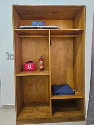 a wooden book shelf with a surfboard on top at Casa Márquez in San Miguel