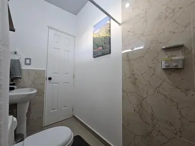 a bathroom with a toilet and a sink at Casa Márquez in San Miguel