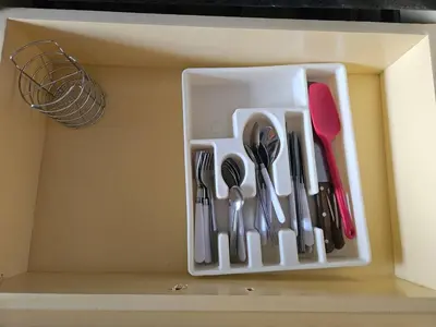 a drawer with some utensils in a box at Casa Márquez in San Miguel