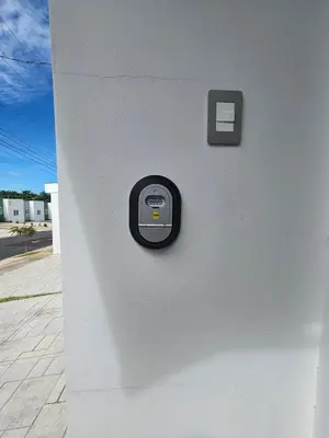 a wall with a button on the side of a building at Casa Márquez in San Miguel