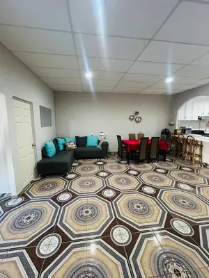 a living room with a couch and a table at Agradable vivienda vacacional in Suchitoto