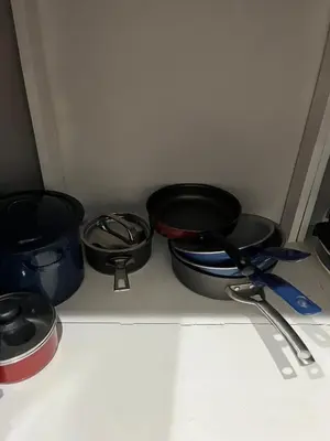 a group of pots and pans sitting on a counter at Pleasant Vacation Home in Suchitoto