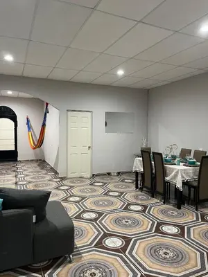 a conference room with a table and chairs and a screen at Pleasant Vacation Home in Suchitoto