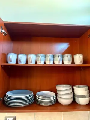 a shelf with plates and bowls on it at Beautiful and Remodeled House Metropolis S Gabriel in Nejapa