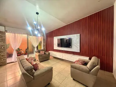 a living room with two couches and a television on a wall at Beautiful and Remodeled House Metropolis S Gabriel in Nejapa