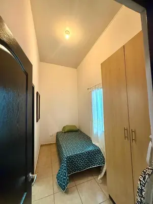 a room with a dog bed in the corner of a room at Beautiful and Remodeled House Metropolis S Gabriel in Nejapa