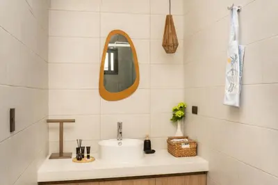 a bathroom with a sink and a mirror at Marcinco in Sonsonate