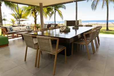 a dining room with a large table and chairs at Marcinco in Sonsonate