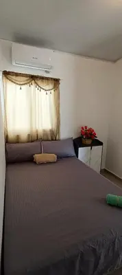 a bedroom with a large bed with a window at Casa de Reyes ll in San Miguel