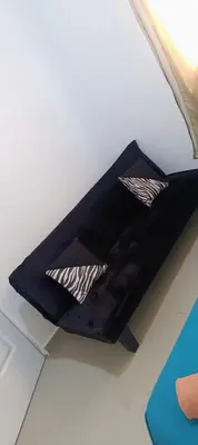 a black shelf with two pillows on a wall at Casa de Reyes ll in San Miguel