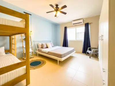 a bedroom with a bed and a ceiling fan at Boa Mare in Nanastepeque